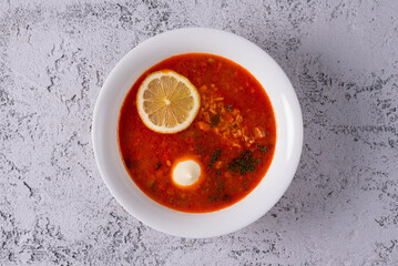 solyanka soup on light concrete