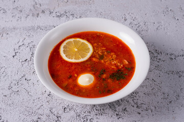 solyanka soup on light concrete