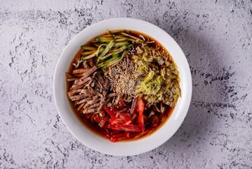 kuksi is a Korean national dish on light concrete