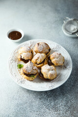 Homemade profiteroles with chocolate paste