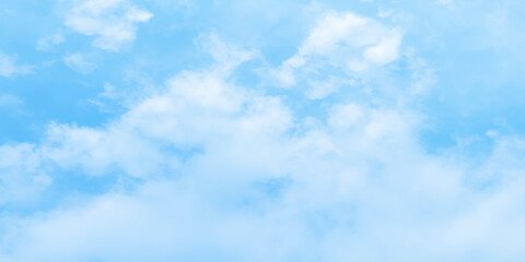 Obraz premium Abstract clear view of natural cloudy sky of winter seasons, Cloudy and bright shinny blue sky background with white clouds, fluffy and blurry summer sky background for wallpaper and design.