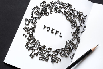TOEFL - black latin letters word, English as a foreign language test, TOEFL concept, white...