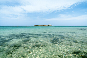 Hypnotic seascape from the Nisos beach in Crete, Greece. Afentis Christos is a small islet with a...