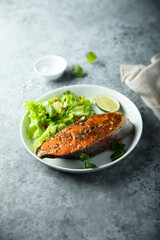 Roasted salmon steak with green salad