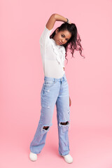 Stylish Hispanic woman touching hair