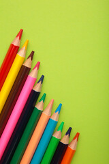 Background from color pencils on green paper.