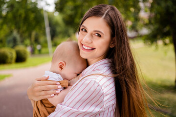 Portrait of charming loving lady mommy enjoy rest relax in countryside forest outdoors infant kid cuddle sleep