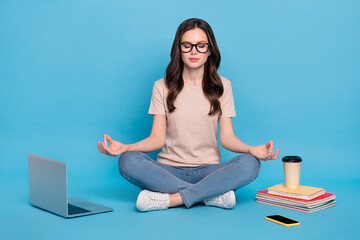 Full length photo of lady high school student meditate before homework doing report isolated blue color background