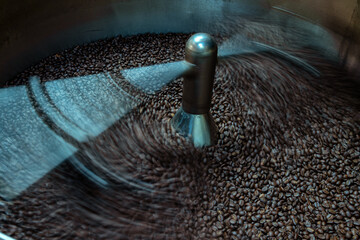 The process of roasting a batch of high quality single origin coffee beans in a large industrial...