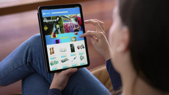 Closeup woman hands holding tablet shopping online store. Person buying products on the internet using device