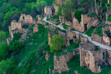 aerial view of the former street among the ruins in the abandoned mountain village of gamsutl in Dagestan