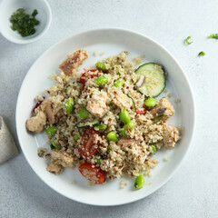 Quinoa bowl with salmon and edamame