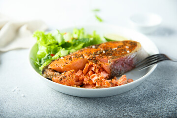 Roasted salmon steak with green salad