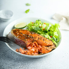 Roasted salmon steak with green salad