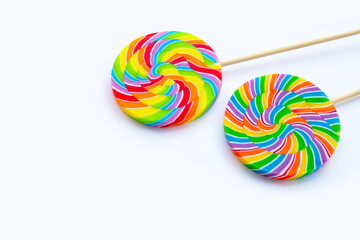 Rainbow lollipop on white background.