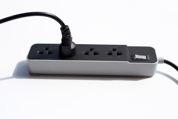 Electrical power strip and plug on white background.