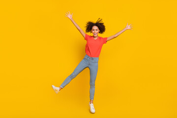 Fototapeta na wymiar Full size portrait of cheerful pretty person enjoy free time flight travel isolated on yellow color background