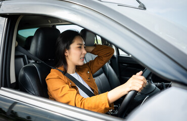 Young asian woman has broken down car on the road she feeling serious and stressed.Look for someone...