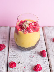 Healthy cold summer exotic smoothie with fruits and raspberries