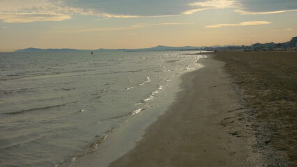Rimini's beach in winter at sunset (Italy)