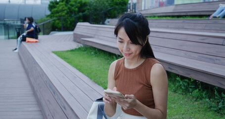 Woman watch on mobile phone at outdoor