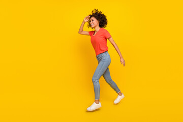 Full body profile portrait of excited attractive lady hand forehead look empty space isolated on yellow color background