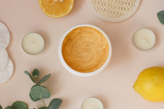 Cosmetic citrus sugar body scrub for peeling and cleansing the skin. Body care, beauty and cosmetic concept. Top view