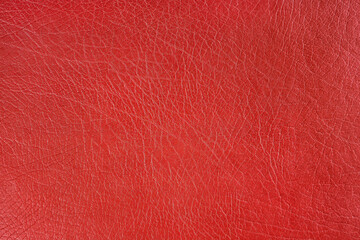 Natural, artificial red leather texture background. Material for sport items, clothes, furnitre and interior design. ecological friendly leatherette.