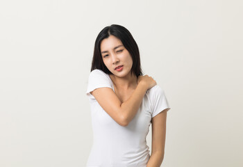Fototapeta premium Asian woman has problem with structural posture She had neck and shoulder pain. She massaged her neck and shoulders for relief. reduce muscle tension. Standing on isolated white background