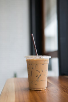 Ice Coffee On Wooden Table,ice Coffee In Take Home Glasses.