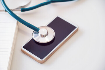 Fototapeta na wymiar Stethoscope medical equipment and mobile phone.