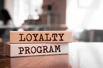 Wooden blocks with words 'Loyalty program'. Business concept