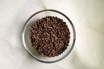 Black peppercorn in glass bowl