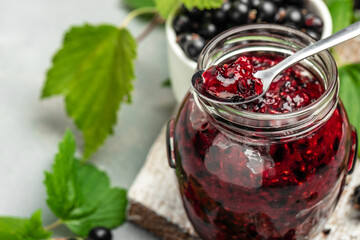The black currant curd, custard or jam and fresh berries, Food recipe background. Close up