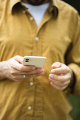 A man communicates on the phone online. Remote communication. Blogger. selfie Mobile Communication. A man is smiling while talking on the phone.