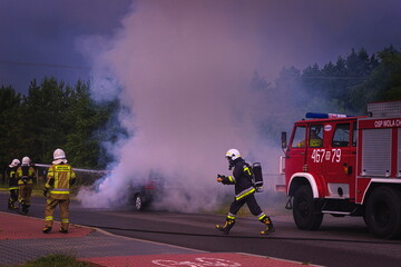 car on fire, rescue operation of the fire brigade