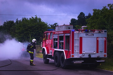 car on fire, rescue operation of the fire brigade