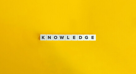 Knowledge Word on Letter Tiles on Yellow Background. Minimal Aesthetics.