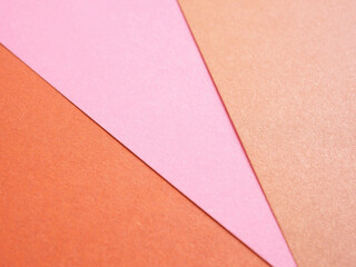 Fototapeta premium Empty gradient pink-orange colored paper background texture. Abstract geometric flat composition. The concept for image, text, and design..