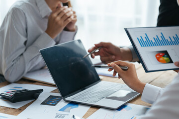 Business people working in the office discussing documents and ideas at meeting, Asian business advisor meeting to analyze and discuss the situation on the financial report.