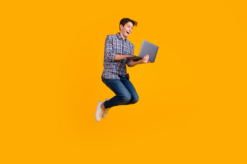Fototapeta na wymiar Photo of funky man jump use laptop search online black friday isolated over bright color background