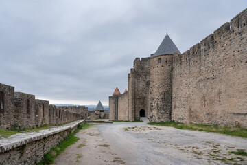 Fototapeta na wymiar Outer bailey of the walled medieval city of Carcassonne with no people and an overcast sky