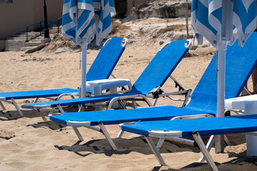 Parasols and sunbeds on Greek beach