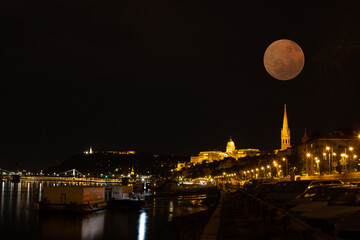 Night landscape with lights and full moon in Budapest - Hungary