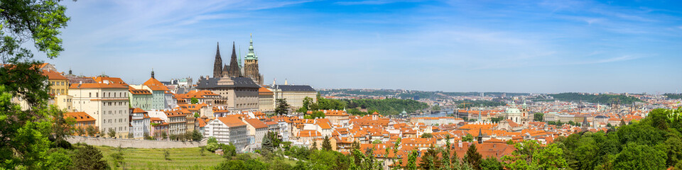 Fototapeta na wymiar Panorama of the Capital of the Czech Republic with Dominant Feature being Prague Castle, View from the Lookout on Petrin Hill Including Greenery and Typical European Architecture