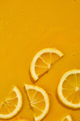 Top view of fresh slice lemons juice and gel serum, organic cosmetics, vitamin C, fresh citrus...