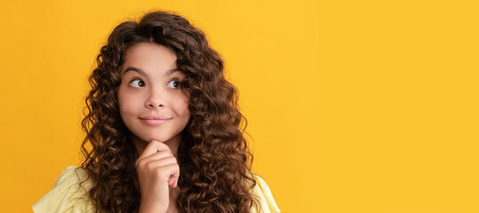 smiling kid with long curly hair and perfect skin, beauty. Child face, horizontal poster, teenager girl isolated portrait, banner with copy space.