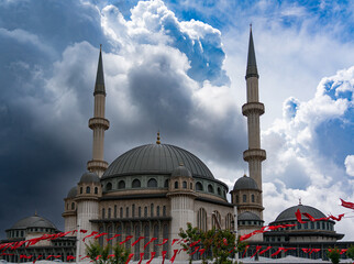 Fototapeta na wymiar Contrast photo of the Taksim Mosque against a dramatic sky