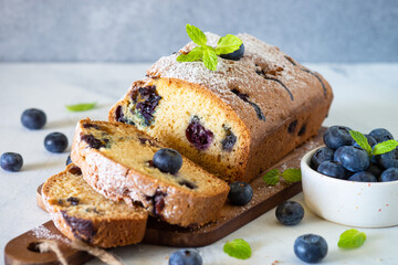 Blueberry cake on white background. Homemade sweet baking.