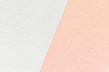 Texture of craft white and pink paper background, half two colors, macro. Structure of vintage...